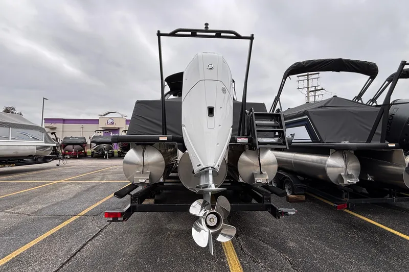 Slide: The Image of 2026 Viaggio D26U pontoon boat with outboard motor in a parking lot. - 3