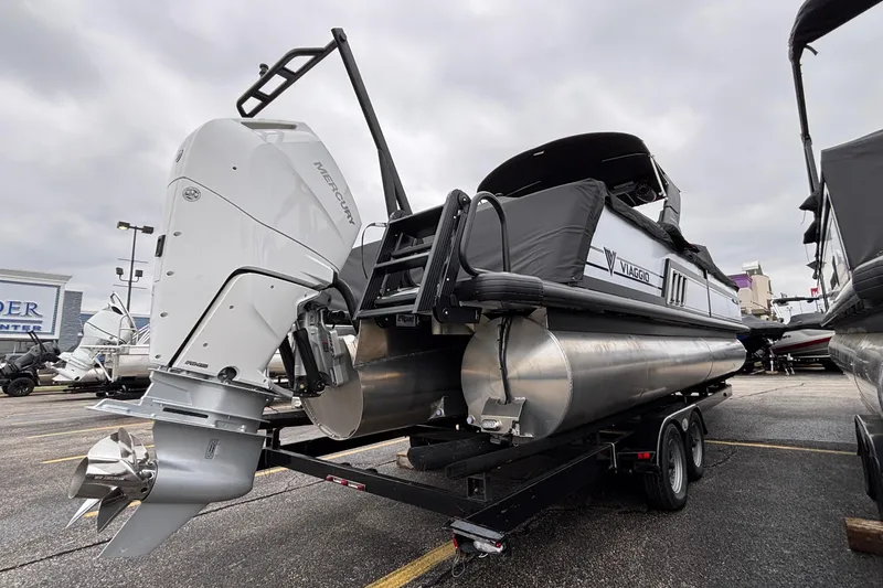 Slide: The Image of 2026 Viaggio D26U pontoon boat with Mercury outboard motor on a trailer. - 4
