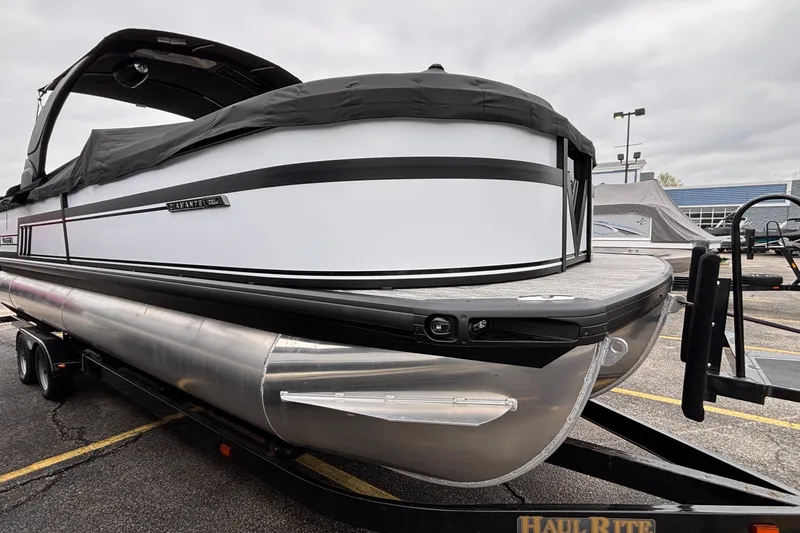 Slide: The Image of 2026 Viaggio D26U pontoon boat on trailer, featuring sleek design and modern features. - 6
