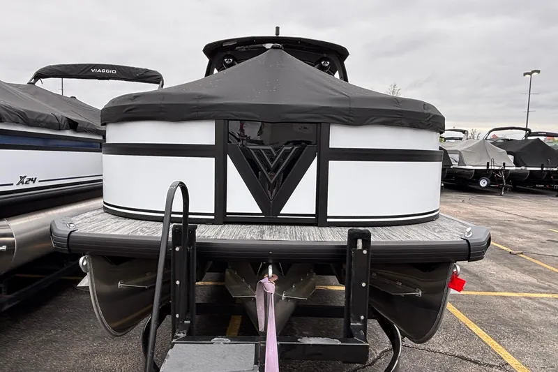 Slide: The Image of 2026 Viaggio D26U pontoon boat with cover, parked in a lot. - 7