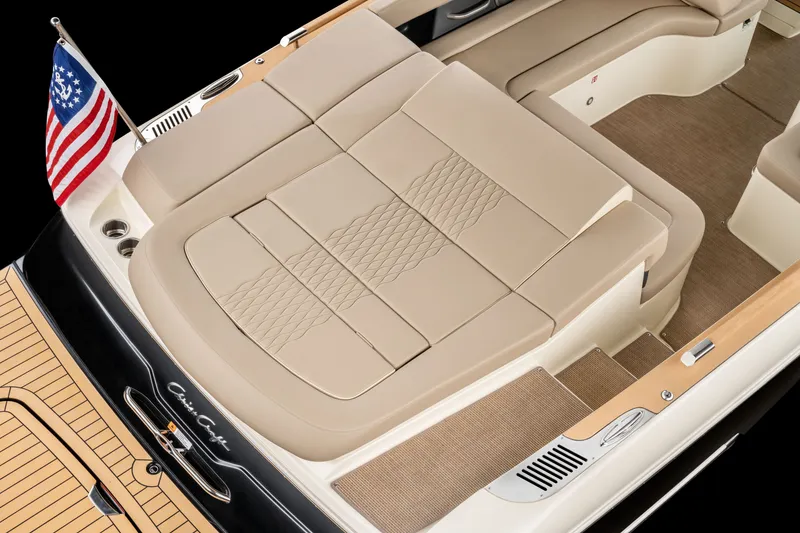 Slide: The Image of Chris-Craft Sportster 28 boat 2027 with luxurious seating area and flag. - 3