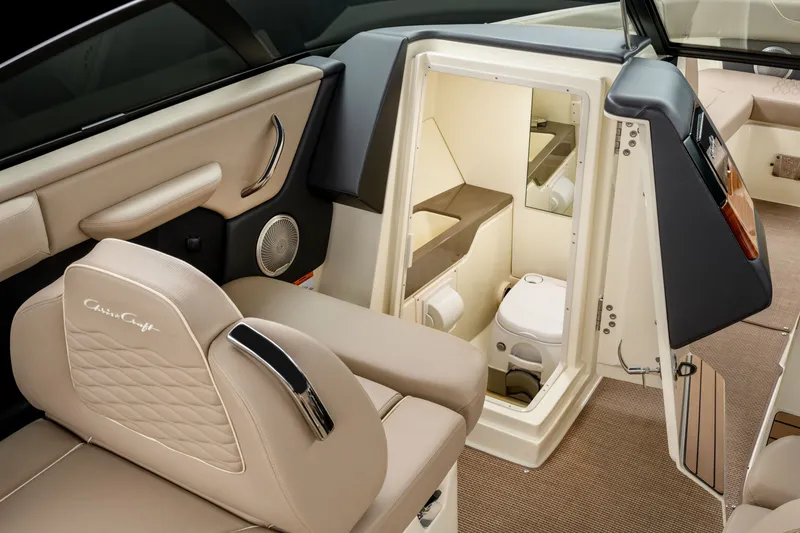 Slide: The Image of Interior of 2027 Chris-Craft Sportster 28 featuring a toilet. - 5