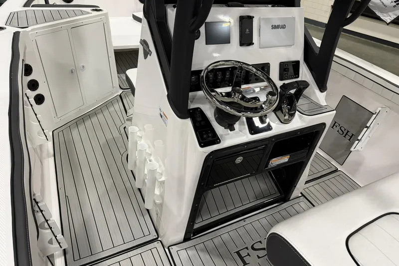 Slide: The Image of 2025 Yamaha Boats 222 FSH Sport E cockpit with advanced controls and sleek design. - 10