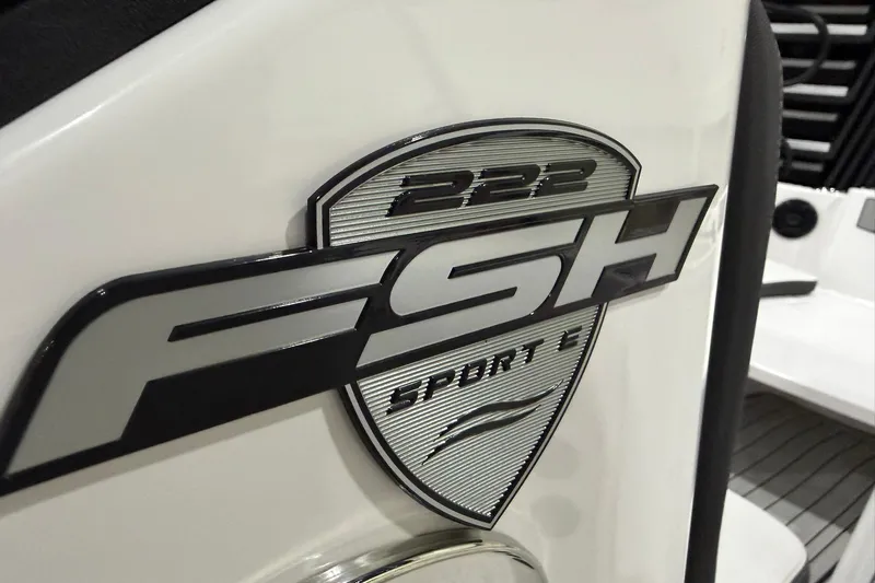 Slide: The Image of 2025 Yamaha Boats 222 FSH Sport E logo on white surface. - 13