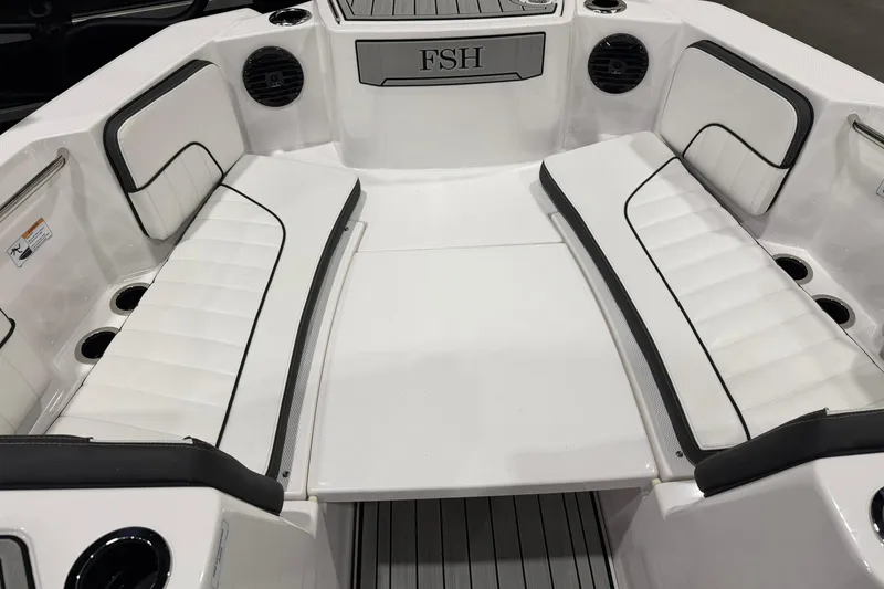 Slide: The Image of Interior view of 2025 Yamaha Boats 222 FSH Sport E, featuring white cushioned seating. - 15