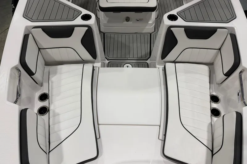 Slide: The Image of 2025 Yamaha Boats 222 FSH Sport E interior with sleek white seating and modern design. - 16