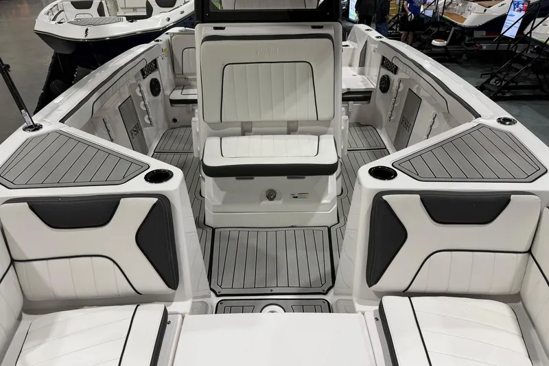 Slide: The Image of 2025 Yamaha Boats 222 FSH Sport E interior with sleek seating and modern design. - 17
