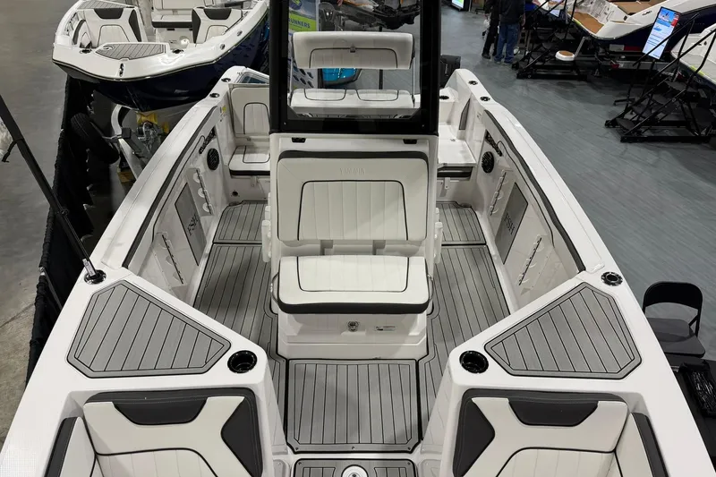 Slide: The Image of 2025 Yamaha Boats 222 FSH Sport E interior with sleek seating and modern design. - 18