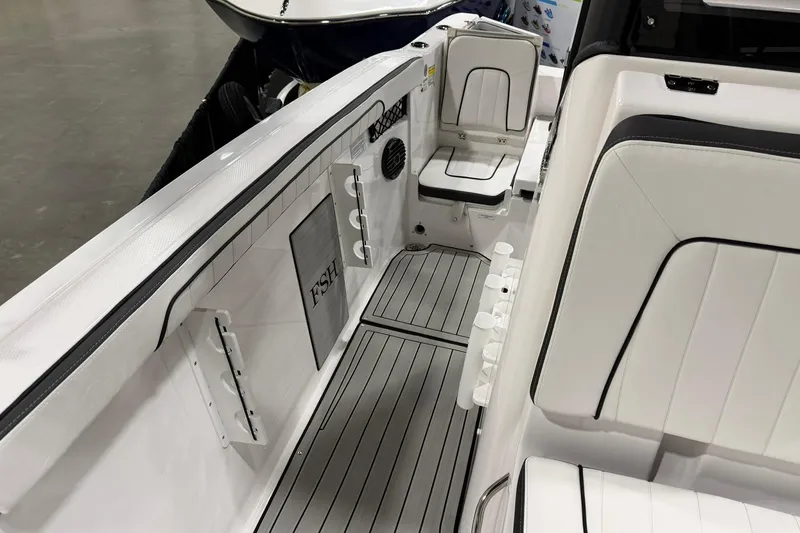 Slide: The Image of 2025 Yamaha Boats 222 FSH Sport E interior with sleek white seating and modern design. - 20