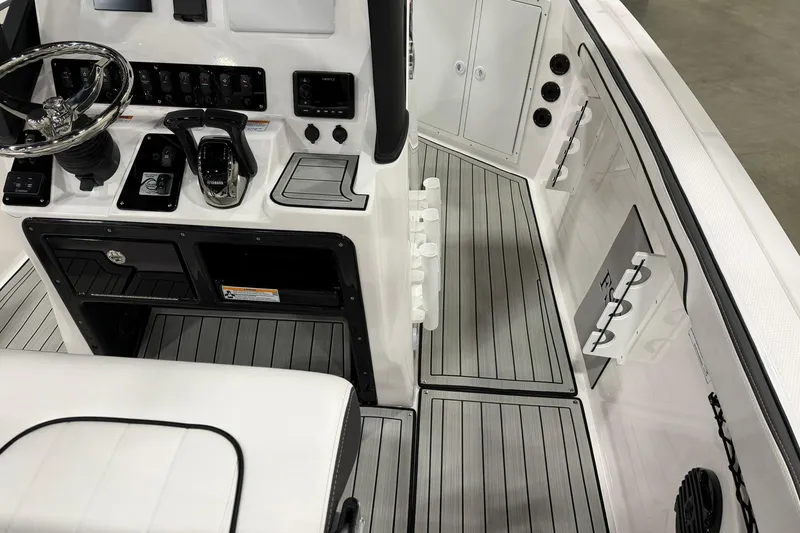 Slide: The Image of 2025 Yamaha Boats 222 FSH Sport E cockpit with sleek controls and modern design. - 9