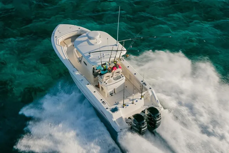 Slide: The Image of Manufacturer Provided Image: 2020 Boston Whaler 280 Outrage cruising on clear blue water. - 17