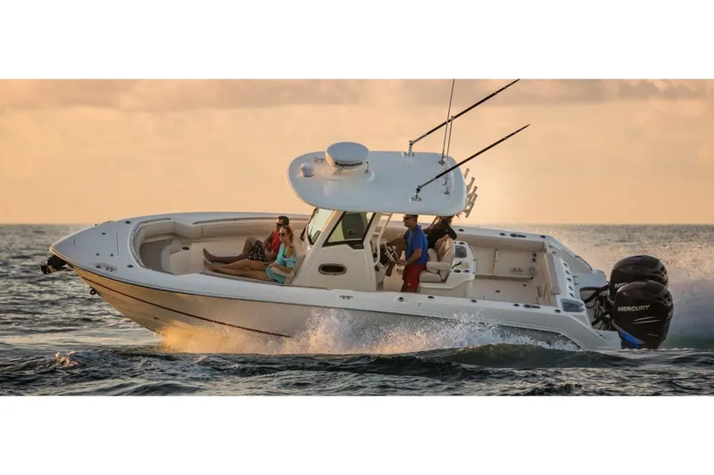 Slide: The Image of Manufacturer Provided Image: 2020 Boston Whaler 280 Outrage boat cruising on the water at sunset. - 18