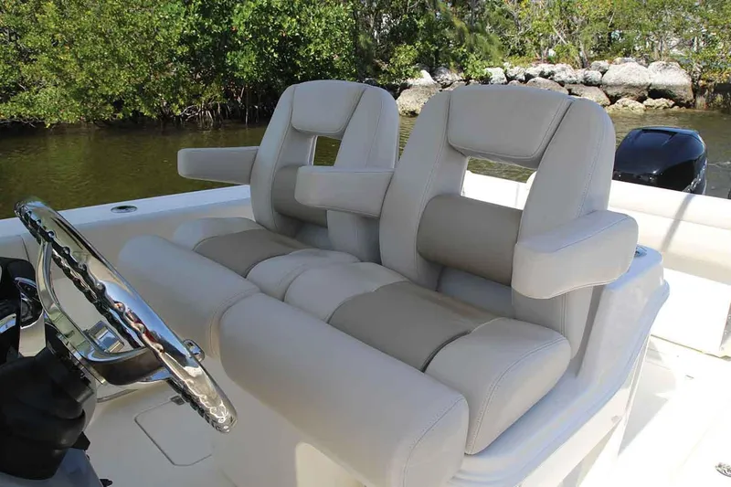 Slide: The Image of Manufacturer Provided Image: 2020 Boston Whaler 280 Outrage boat with dual cushioned seats and steering wheel. - 6