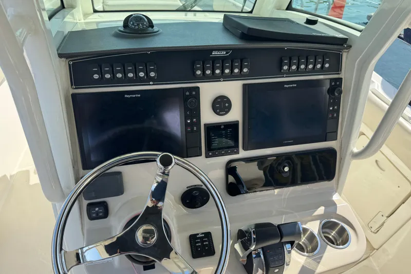 Slide: The Image of Control panel of a 2020 Boston Whaler 280 Outrage with dual Raymarine displays. - 7