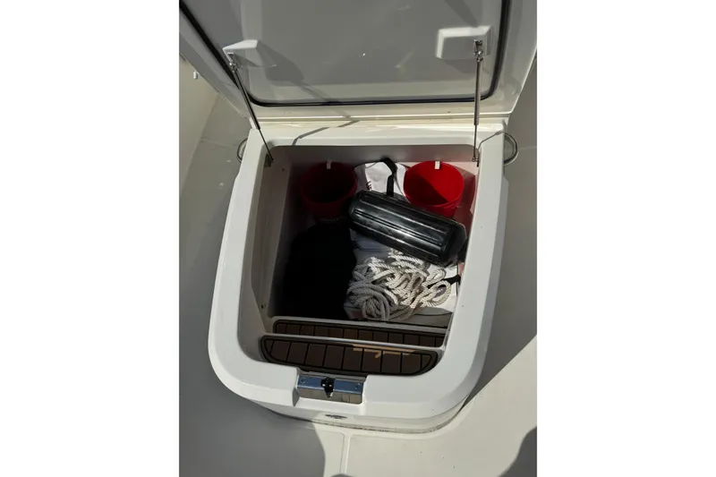 Slide: The Image of Storage compartment on a 2020 Boston Whaler 280 Outrage with ropes and accessories. - 9