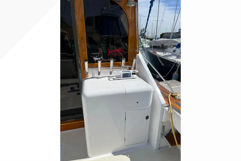 Slide: The Image of Fishing tackle storage on a 1971 Pacifica 44 Convertible boat, featuring labeled compartments. - 17