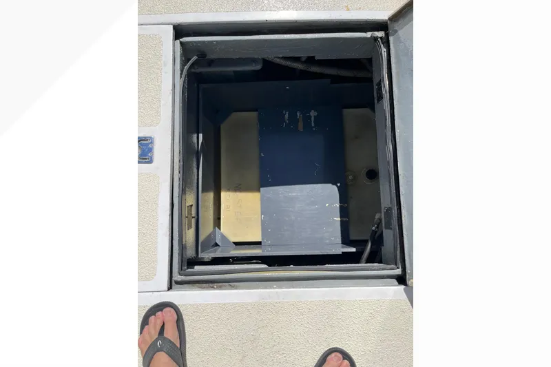 Slide: The Image of Open hatch on 1971 Pacifica 44 Convertible boat deck, revealing interior compartment. - 21