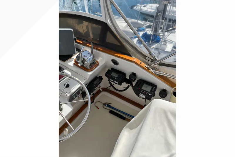 Slide: The Image of 1971 Pacifica 44 Convertible yacht cockpit with steering wheel and navigation equipment. - 26