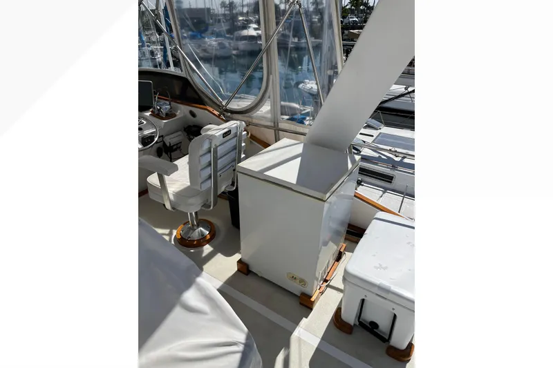 Slide: The Image of 1971 Pacifica 44 Convertible yacht interior with helm station and seating. - 30