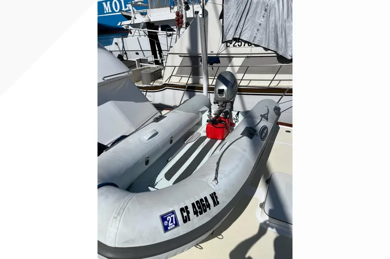 Slide: The Image of Inflatable boat with motor on deck of 1971 Pacifica 44 Convertible yacht. - 33