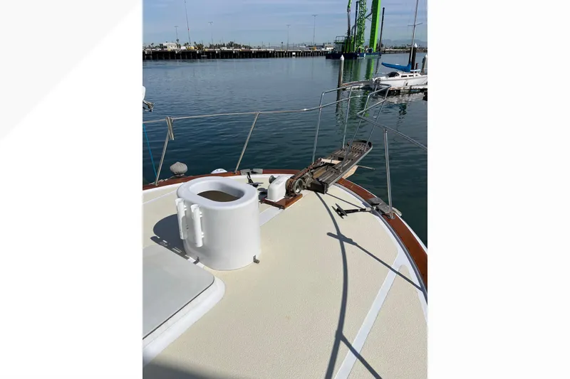 Slide: The Image of 1971 Pacifica 44 Convertible yacht deck with railing, docked at marina. - 35