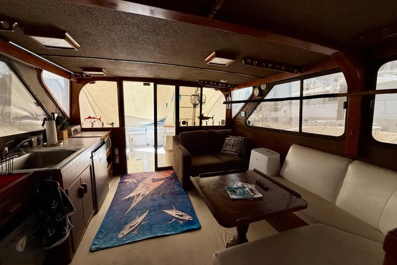 Slide: The Image of Interior of a 1971 Pacifica 44 Convertible boat with cozy seating and nautical decor. - 37