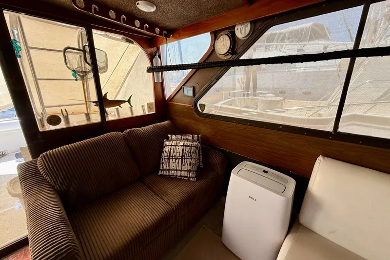Slide: The Image of Interior of a 1971 Pacifica 44 Convertible boat with a well-equipped kitchen area. - 38