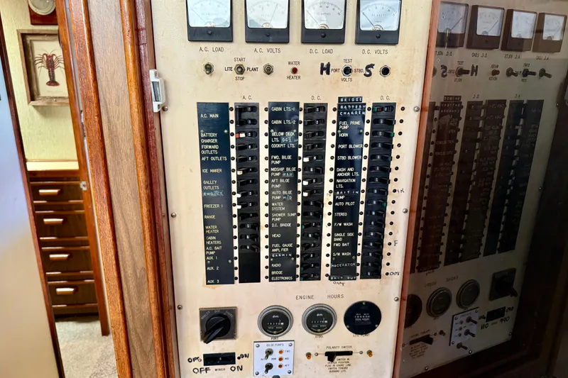 Slide: The Image of Electrical control panel on a 1971 Pacifica 44 Convertible boat, featuring various switches and gauges. - 40