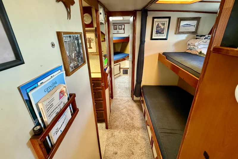 Slide: The Image of Interior of a 1971 Pacifica 44 Convertible boat with cozy bunks and nautical decor. - 41