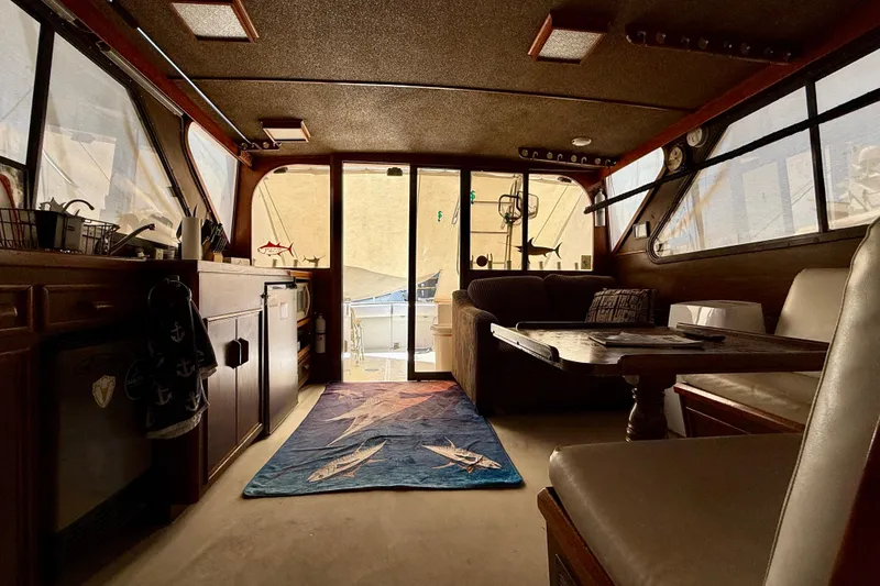 Slide: The Image of Interior of a 1971 Pacifica 44 Convertible yacht with cozy seating and decor. - 42
