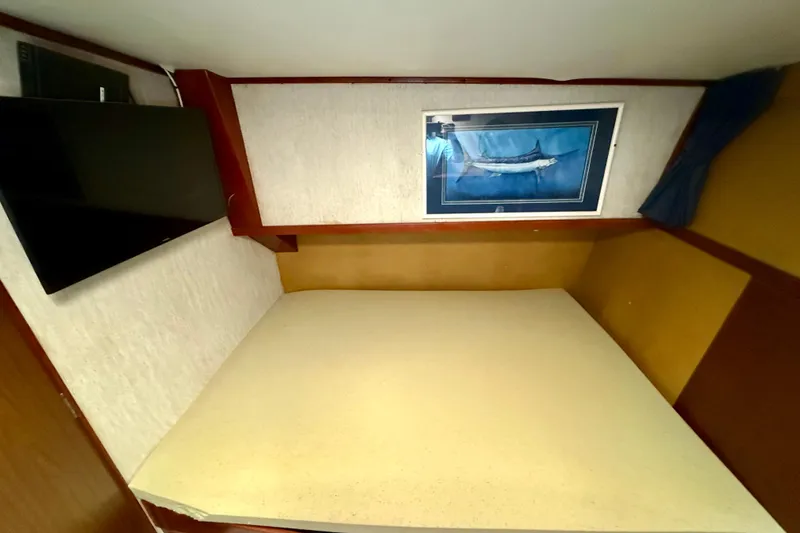 Slide: The Image of 1971 Pacifica 44 Convertible cabin with bunk beds, nautical decor, and cozy interior. - 44