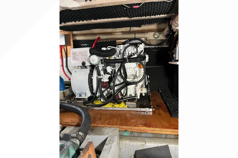 Slide: The Image of Battery setup with red and black cables in a 1971 Pacifica 44 Convertible. - 53