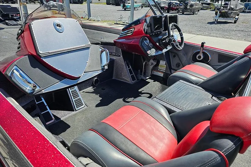 Slide: The Image of 2015 Ranger Z521 Comanche boat interior with red and black seats, steering console. - 10