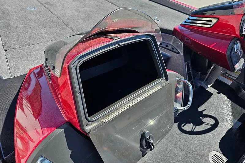 Slide: The Image of 2015 Ranger Z521 Comanche boat dashboard with open storage compartment. - 14