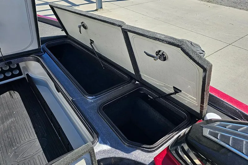 Slide: The Image of Open storage compartments on a 2015 Ranger Z521 Comanche boat. - 18