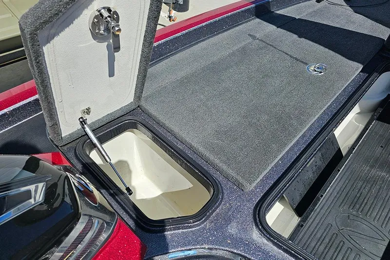 Slide: The Image of 2015 Ranger Z521 Comanche boat storage compartment with open lid and hydraulic lift. - 19