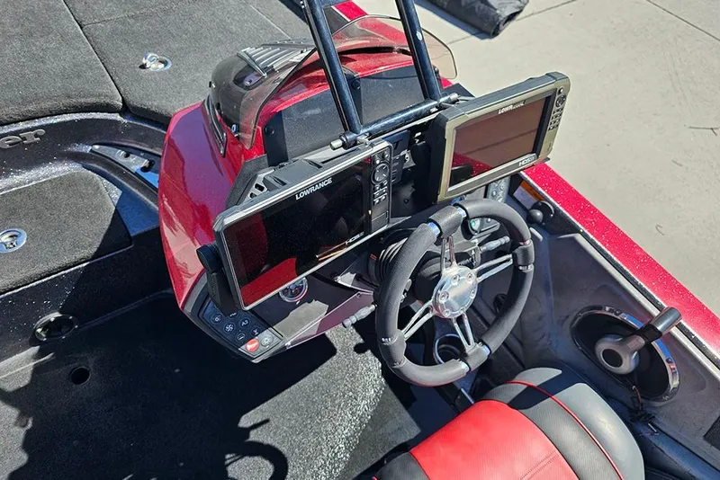 Slide: The Image of 2015 Ranger Z521 Comanche boat dashboard with Lowrance electronics and steering wheel. - 22