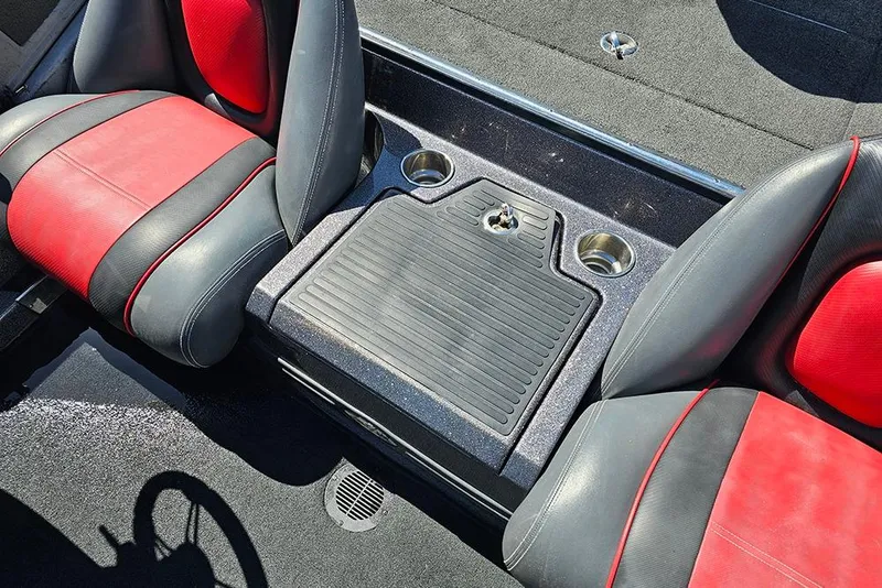 Slide: The Image of 2015 Ranger Z521 Comanche boat interior with red and black seats and cup holders. - 24