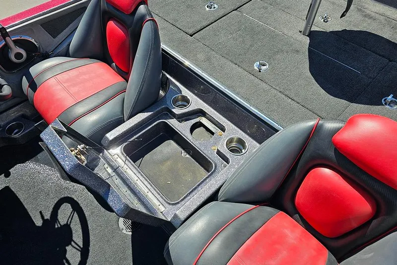Slide: The Image of 2015 Ranger Z521 Comanche boat interior with red and black seats and storage compartments. - 25