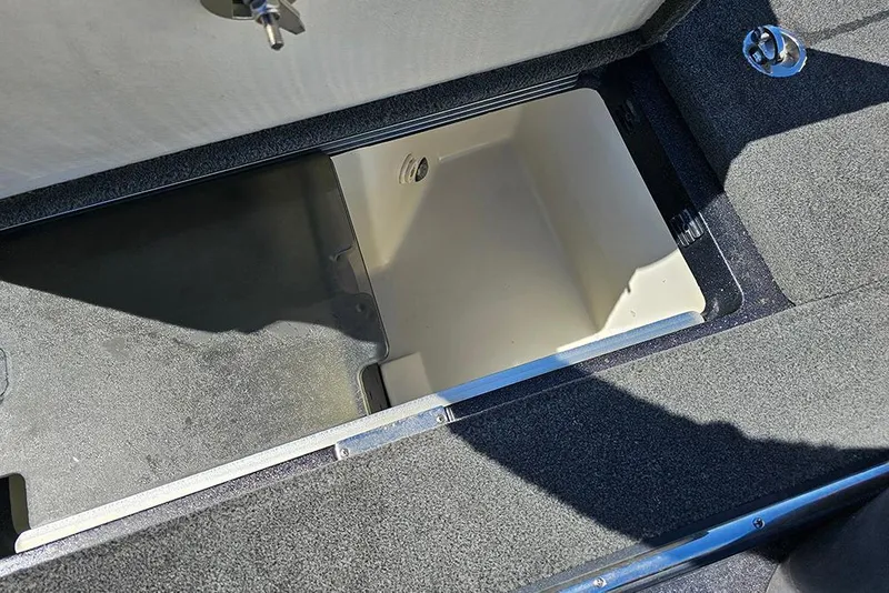 Slide: The Image of 2015 Ranger Z521 Comanche storage compartment with open lid, showcasing interior space. - 27