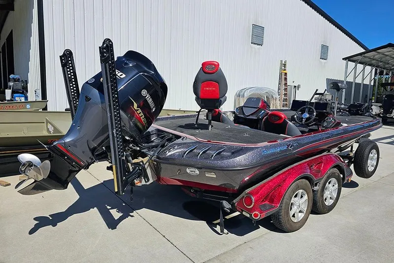 Slide: The Image of 2015 Ranger Z521 Comanche bass boat with Yamaha engine, parked on a trailer. - 3