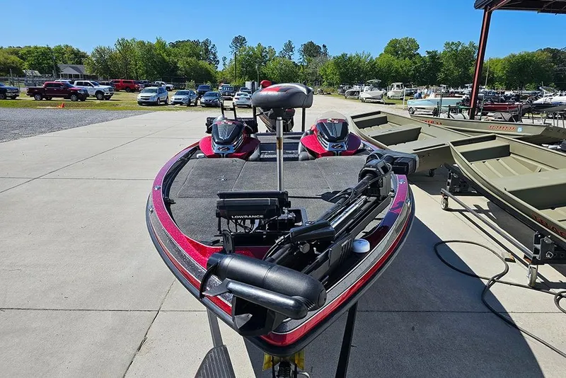 Slide: The Image of 2015 Ranger Z521 Comanche bass boat parked outdoors, featuring advanced fishing equipment. - 4