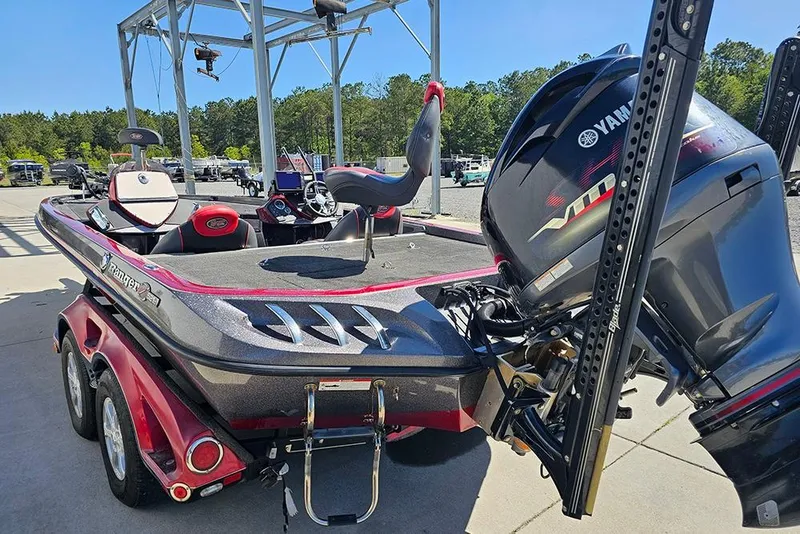 Slide: The Image of 2015 Ranger Z521 Comanche boat with Yamaha motor, parked outdoors on a sunny day. - 7