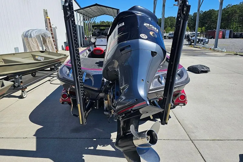 Slide: The Image of 2015 Ranger Z521 Comanche boat with Yamaha 250 engine, parked outdoors. - 8