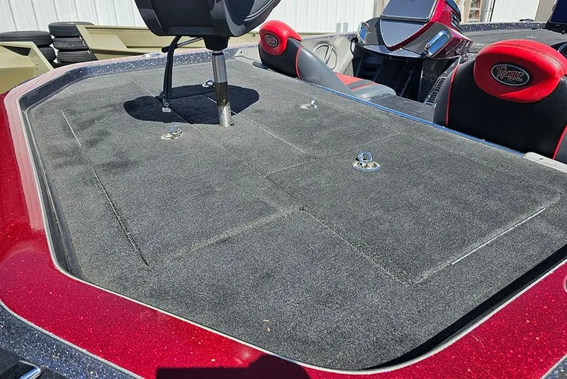 Slide: The Image of 2015 Ranger Z521 Comanche boat deck with red accents and seating. - 9