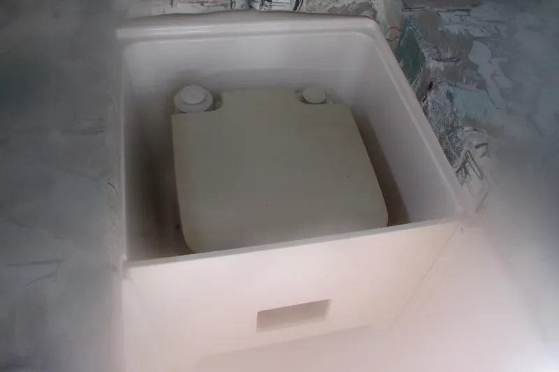 Slide: The Image of Storage compartment in a 1998 Grady-White Adventure 208 boat interior. - 19