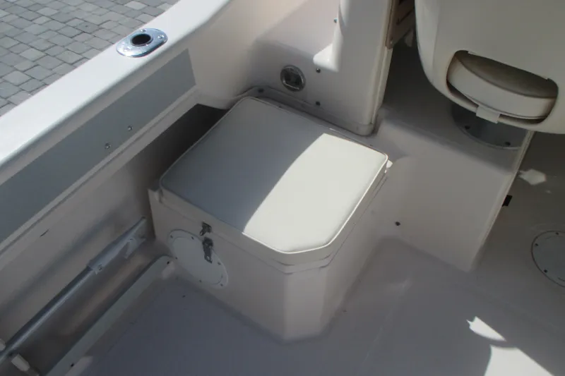 Slide: The Image of Interior view of a 1998 Grady-White Adventure 208 boat, featuring seating and storage. - 25