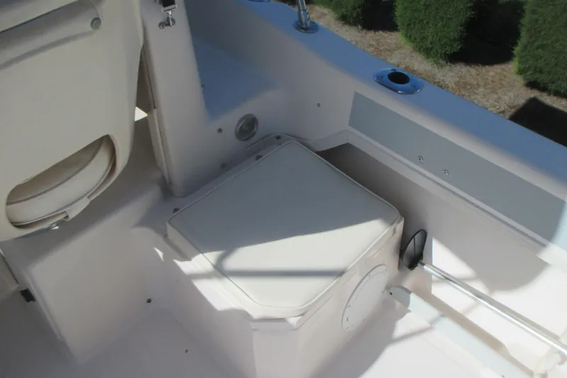 Slide: The Image of Interior view of a 1998 Grady-White Adventure 208 boat, featuring seating and storage. - 26