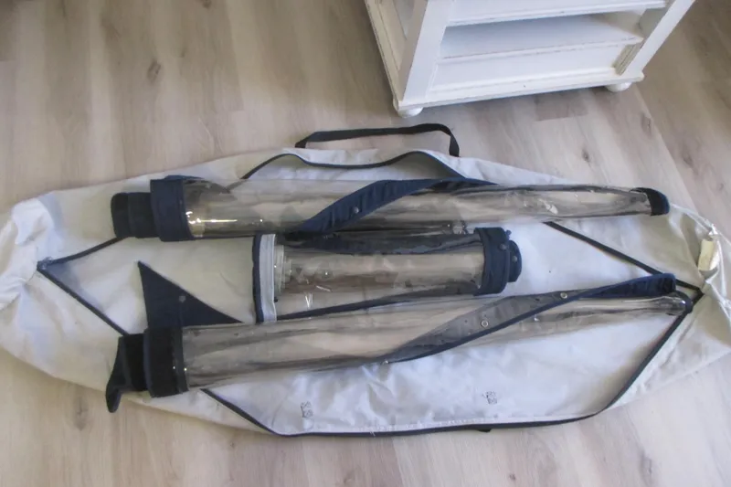 Slide: The Image of Boat enclosure panels for 1998 Grady-White Adventure 208, laid on a wooden floor. - 33