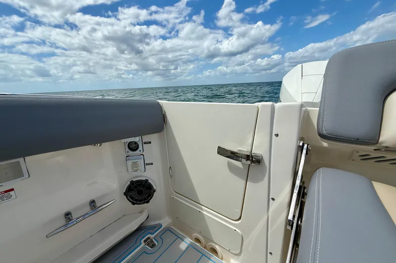 Slide: The Image of Boston Whaler 350 Realm 2025 boat interior with ocean view and blue sky. - 13